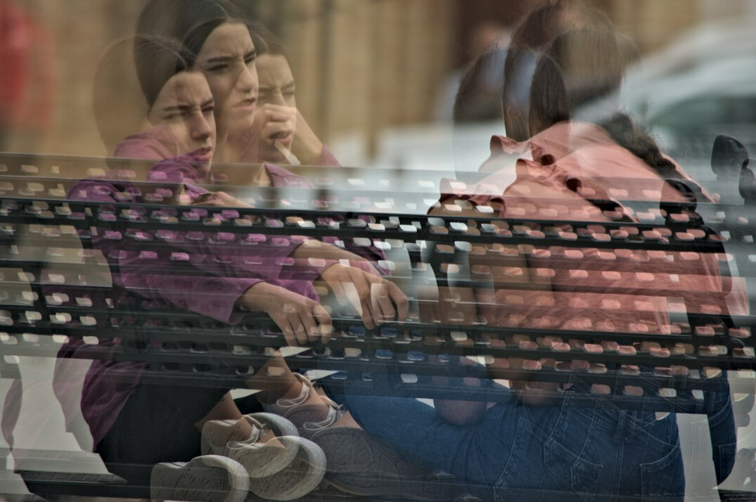 woman sharing story bench