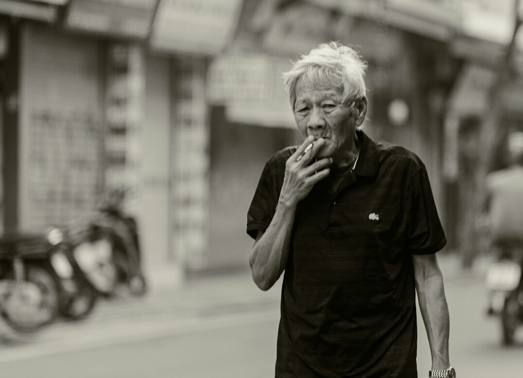 elderly man talking street
