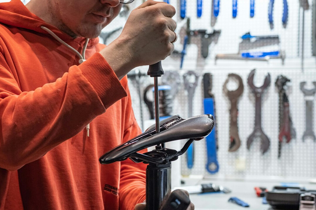 man repairing bicycle