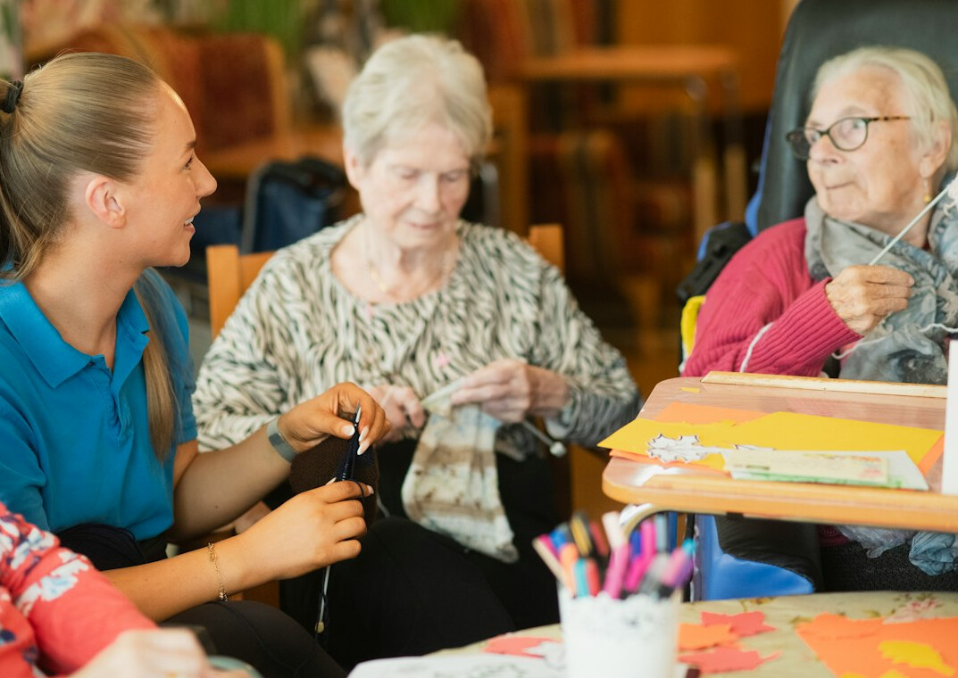 group of women knitting together