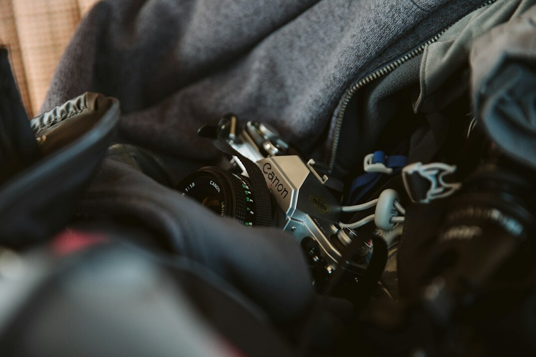 photographer packing camera gear
